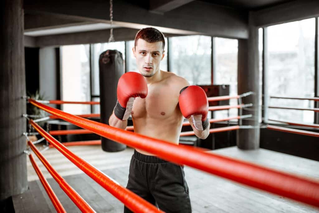 Man tarining to box at the gym