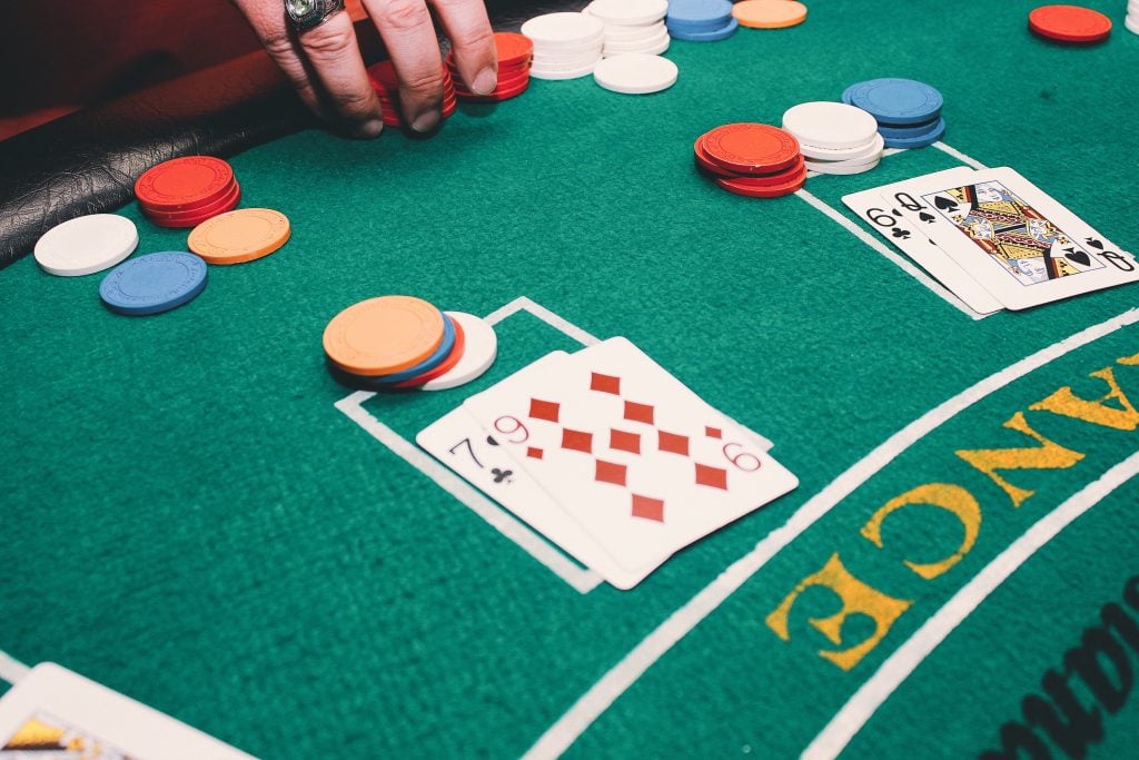Blackjack players decide whether to hit or stay.
