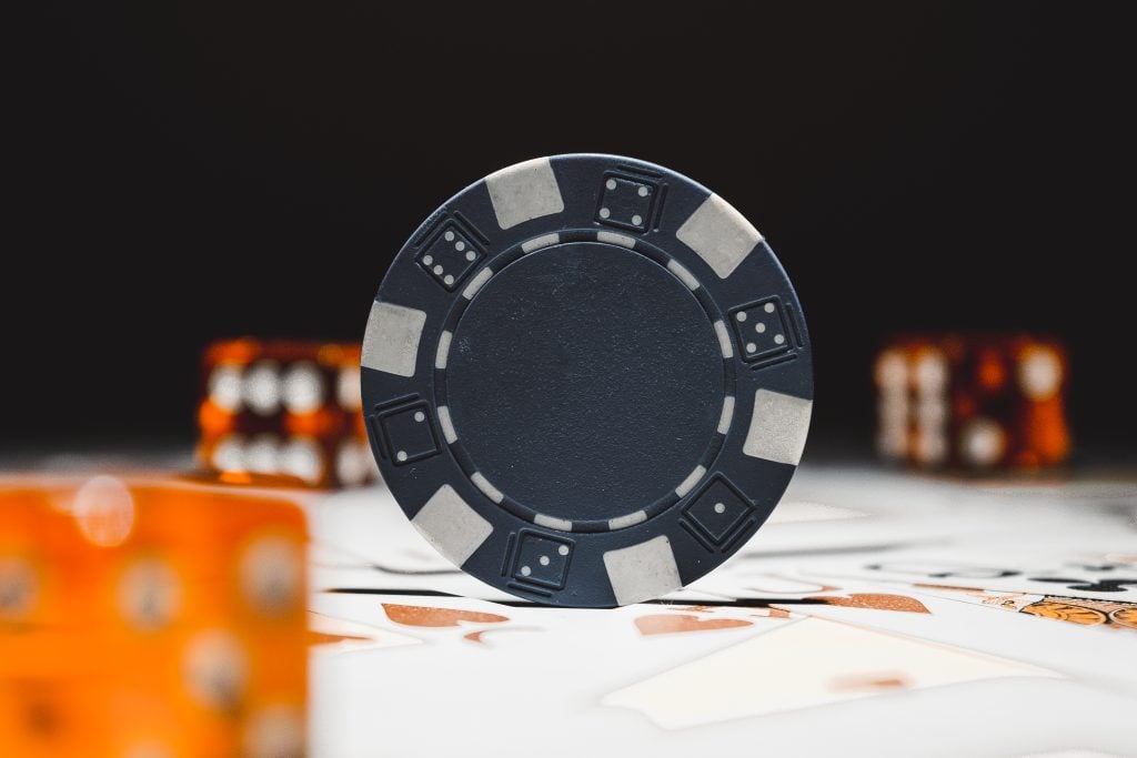 Blue poker chip, dices and playing cards. Casino and gambling concept.