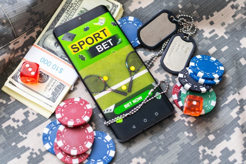 Concept for online casino, gambling, online money games, bets. Smartphone and pretty girl with