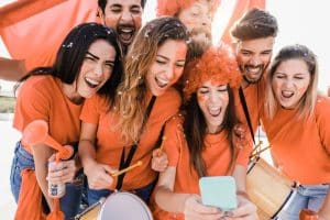 orange-sport-supporters-watching-football-game-on-2023-11-27-05-36-25-utc